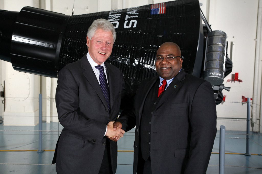 Donnell Nichols shaking hands with former President Bill Clinton